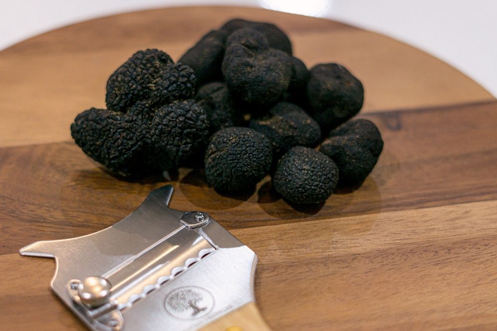 Black truffles on a board