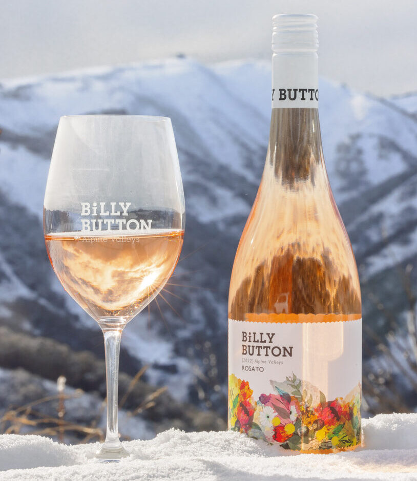 Billy Button Wildflower Rosato and glass in the snow at Mt Hotham