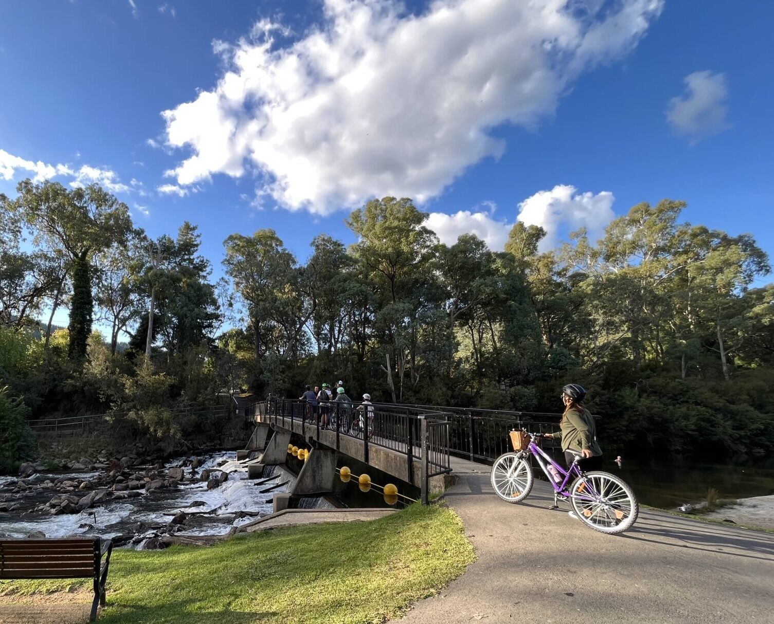 Cycling across the Ovens River at Bright Centenary Park